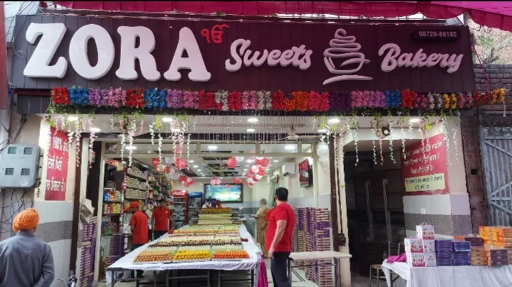 Zora Sweets decorated shop front during festival